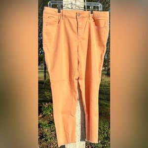 Womens peach colored jeans, slim fit, frayed ankle, size 16